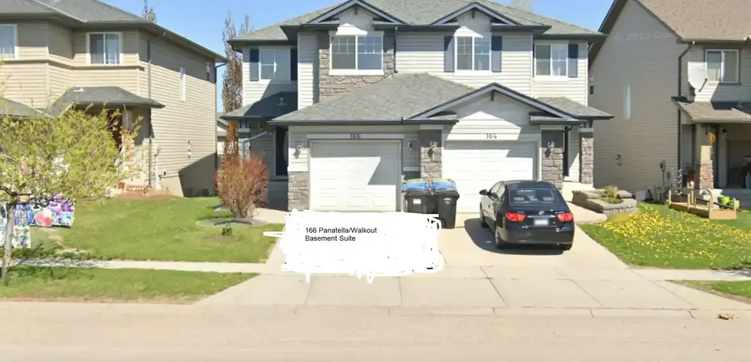 Beautiful three bedroom unit next to bus stop and backing on trail and green | 166 Panatella Boulevard Northwest, Calgary | 2906373