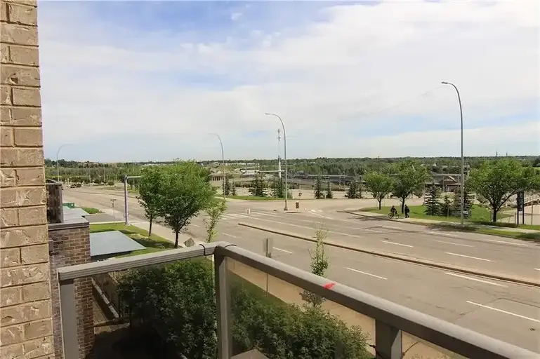 STUNNING WALK UP TOWNHOME, CLOSE TO FISH CREEK PARK & LRT ACROSS THE STREET | 10 Shawnee Hill SW, Calgary | 2941765