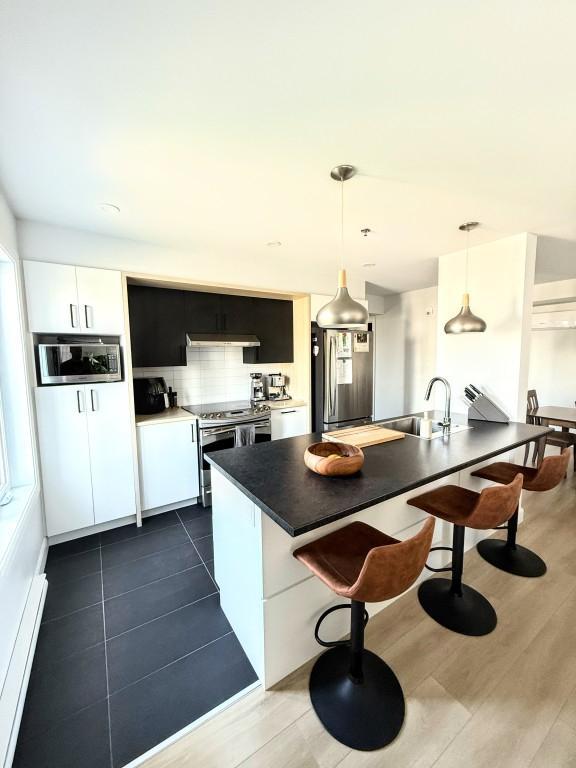 Lumineux et Grand 3 1/2/ Stationnement intérieur /Situé près des Ponts / Lévis | 2976916