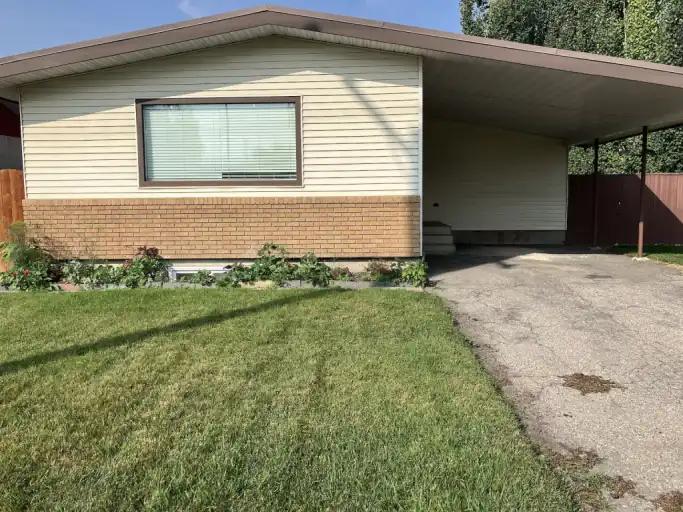 3 bedroom main floor with a large fenced  yard large deck carport parking | 447 Acadia Drive Southeast, Calgary | 3025260