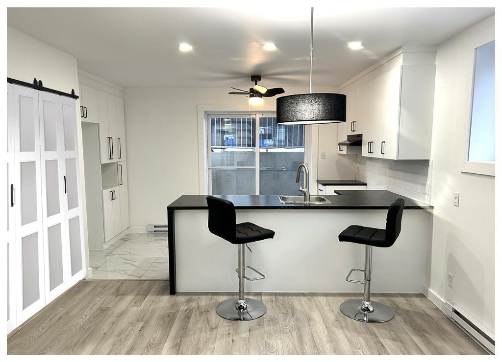 Logement 4 1/2 • Luxueux Neuf • demi-sous sol • Sainte Anne des Plaines | 3135174