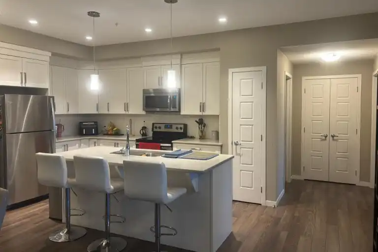 2 Bed + Den/Studio | 2 Bath | 1,158 sq ft | New Brighton SE | Underground Parkin | 209 - 6703 New Brighton Avenue Southeast, Calgary | 3149148