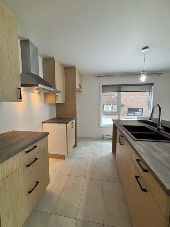 Appartement 4 1/2 rez-de-chaussée lumineux | 3188591