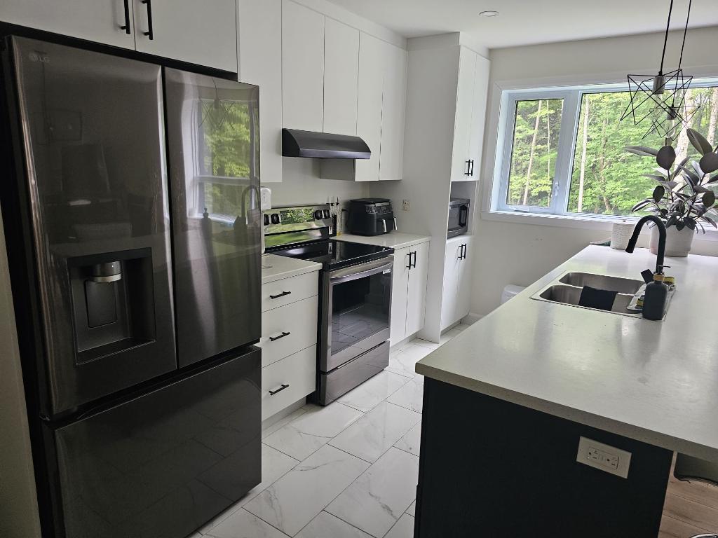 Magnifiques logements neuf 4 ½ avec ascenseur unique ! 450 775.1379 | 3204378