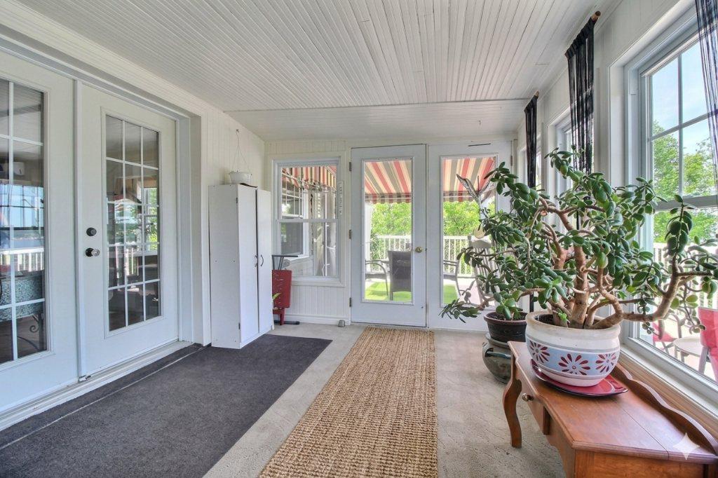 Vue fleuve 180° — Unité de prestige avec solarium, immense patio et terrain | 3234131