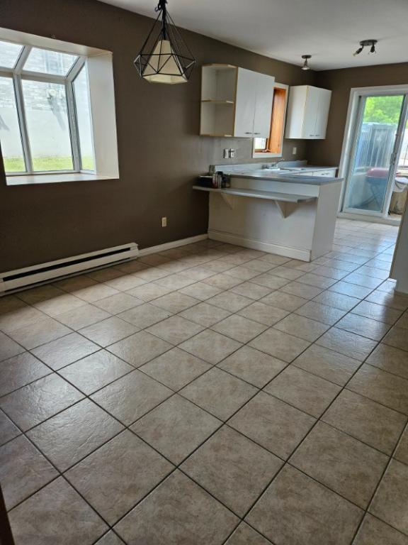Un grand lumineux 4 1/2 sur un triplex à louer | 3279978