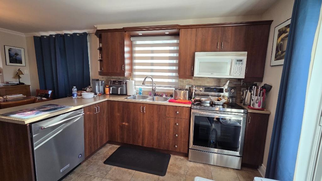 Carrefour Laval très jolie et grand 4 ½ de style condo, situé au 1er étage d’un triplex | 3297417