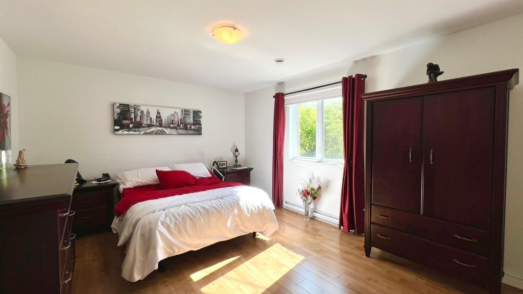 grand 4 1/2 St-Hubert, accès ascenseur, vue sur boisé | 3311509