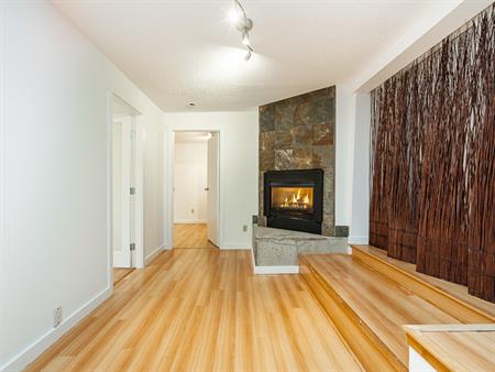 UPPER LONSDALE CHARM: COZY 2-BEDROOM SUITE WITH FIREPLACE AND PRIVATE DECK. UTILITIES INCLUDED | 261 Osborne Road East, North