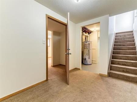 Basement suite with 1 bedroom, 1 full bath, and a kitchenette area | 79 Abalone Way Northeast, Calgary