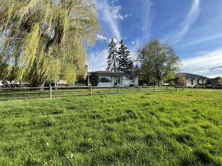 Expansive 4-Bedroom Home on 2.28 Acres: Okanagan Ave Retreat