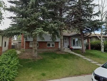 STOP & Take a LOOK at this bright & open SE 5 Bdrm house, garage & Fenced yard | 339 Queensland Place Southeast, Calgary