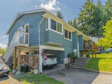 Upper Three Bedroom Suite with Laundry and Fenced Yard