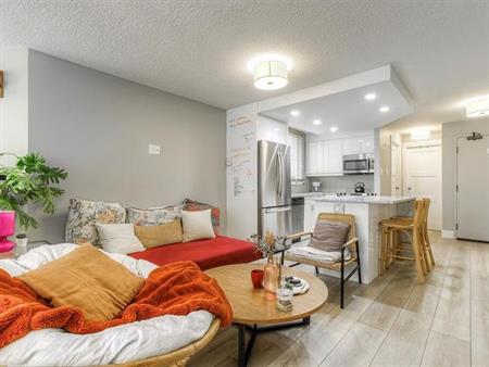 Sunlit 2-Bedroom + Den Condo w/ 2 Parking Stalls & A/C in the Heart of the City | 203 - 626 15 Avenue Southwest, Calgary