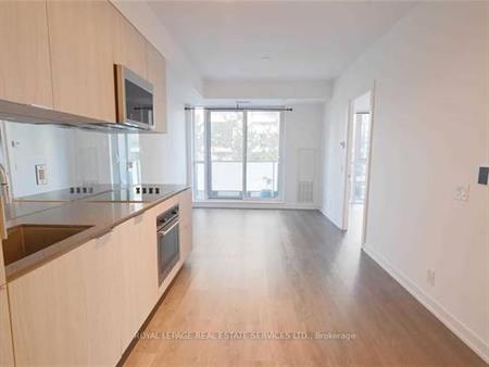 Feels brand new + den parking included near st.clair west!