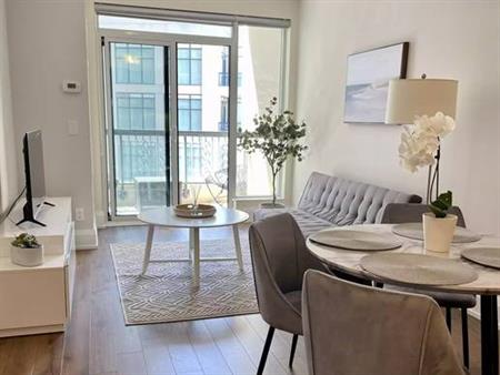 Fully Furnished 1 Bed + Den Luxury Suite Steps to Subway Station in Bl