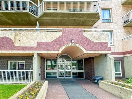 High rise concrete building 2 Bedrooms 1 Bathroom Condo in Stadium | 605 - 11211 85 St NW, Edmonton