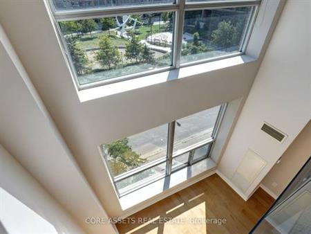 TWO LEVELS LIBERTY VILLAGE 1 BED 2 BATHS PARKING INCLD