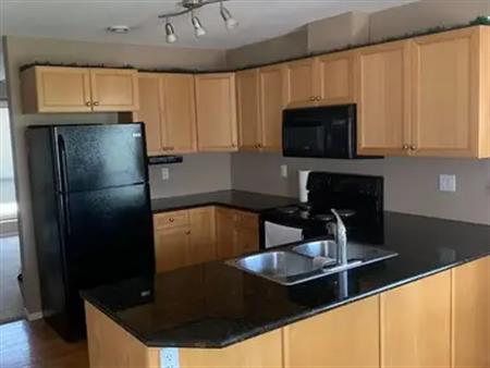 Pet friendly sunny end unit townhouse with beautiful mountain views | High River