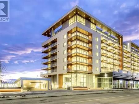 Spacious and bright 2 bed+ condo with huge den,large balcony,underground parking | 210 - 8505 Broadcast Avenue Southwest, Cal