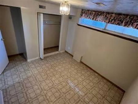 Vacant 1-Bedroom +Den Basement Apartment at Rogers & Caledonia