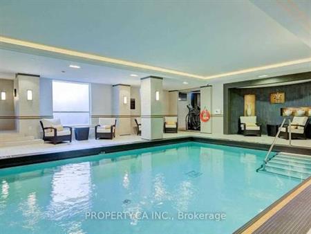 Luxurious feel indoor pool + den parking included!