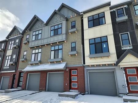 2+Den Townhouse in Springbank Hills with Heated Garage | Spring Willow Cl SW, Calgary