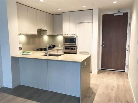 Modern 1-Bedroom + Den + Parking Condo in Prime Cambie Location