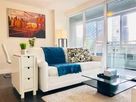 1 Bedroom and Den Suite with Hardwood Floors and Balcony