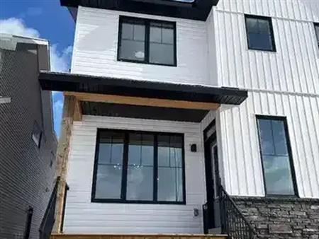 STUNNING BRAND NEW 3 BEDROOM PLUS 2.5 BATH AND A BONUS ROOM—-CREEKSTONE SW | 21214 Sheriff King Street Southwest, Calgary