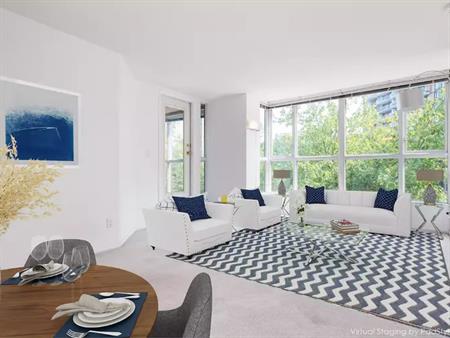 Unfurnished 2 Bedroom+Solarium Apartment+In-Suit Laundry+Parking+Kitchen Pantry+Hardwood floors+Water Included | 288 East 8th