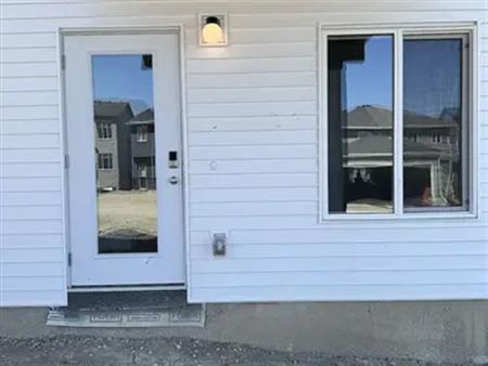 Bright Walkout Basement Suite Across Future Green Space | 110 Edith Green Northwest, Calgary
