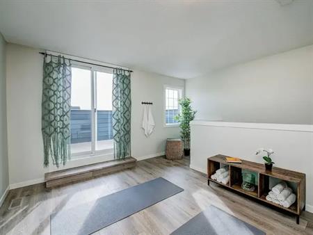 Previous Showhome in Cranston Riverstone with Rooftop Patio and Fenced Backyard | Calgary