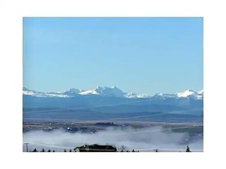 Executive Townhome w beautiful Mountain View! full Gym, 2 Indoor parking, & A/C | 148 Rockyledge View NW, Calgary