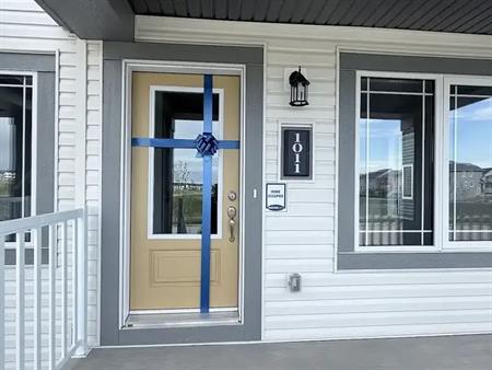 Brand new, fully-upgraded town house facing nature reserved green space | 148 Ave NW, Calgary