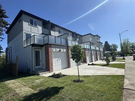 The Patio Residences: 2 Bedroom + Den Townhomes w/ Attached Garage Banff Trail | 5 - 2202 25 Avenue Northwest, Calgary