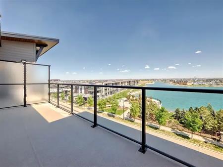 TOP FLOOR BRAND NEW EXECUTIVE CONDO WITH UNOBSTRUCTED VIEW OF MAHOGANY LAKE | 1802 Mahogany Boulevard Southeast, Calgary