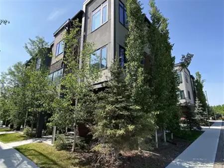 Furnished 3BR + Den Townhome in Greenwich NW– City Views, Nature Access, and Eve | Calgary