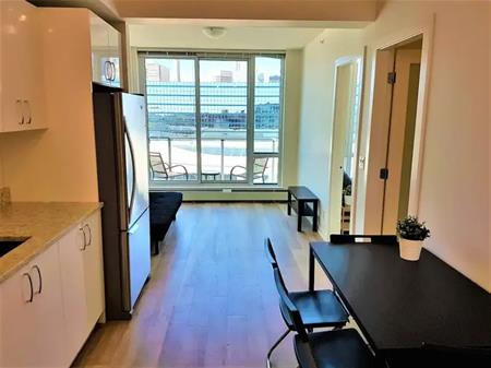Furnished top floor 2-bedroom condo in N3 | 450 8 Ave SE, Calgary