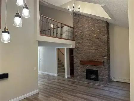 Top floor - 2 story open loft - June 2025 renovated - woodburning fireplace! | 402 - 1111 13 Ave SW, Calgary