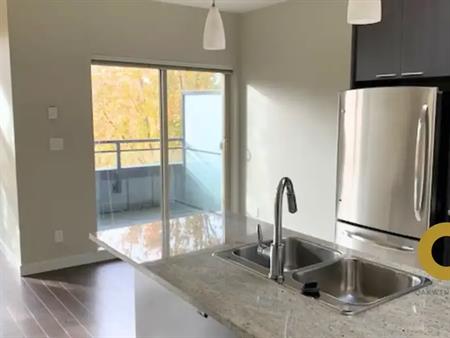 Top-Floor 1 Bed Unit with 12-Foot Ceilings & 2 Balconies in Fraserhood | 707 East 20th Avenue, Vancouver