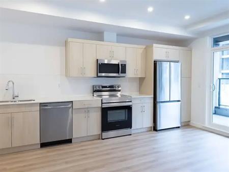 Newly built 1 bed, 1 bath condo with Air Conditioning, Main Floor | 3700 Seton Avenue Southeast, Calgary