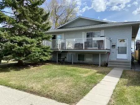 Recently renovated & city central!  This unit has its own private entry door, and parking stall. | 409 55 Avenue Southwest, C