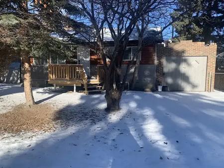 Cozy 2 bedroom furnished independent house on a quiet street with mature trees. | 6016 33 Avenue Northwest, Calgary