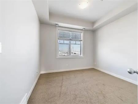 TWO BEDROOM TOWNHOUSE TOP FLOOR GREAT VIEW FROM SOUTH FACING BALCONY $1600 | 193 Cranford Walk Southeast, Calgary