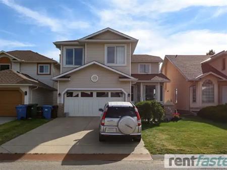 Lake access! Spacious furnished, bright, modern 2-bedroom walkout in Arbour Lake | Calgary