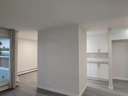 2BR townhome style condo across street from  Market mall | 202 - 3615 49 St NW, Calgary
