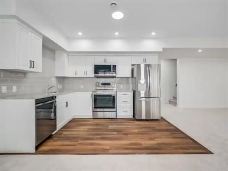 WALK-OUT VERY BRIGHT AND LARGE 2 BEDROOM SUITE | 124 Lewiston Landing Northeast, Calgary