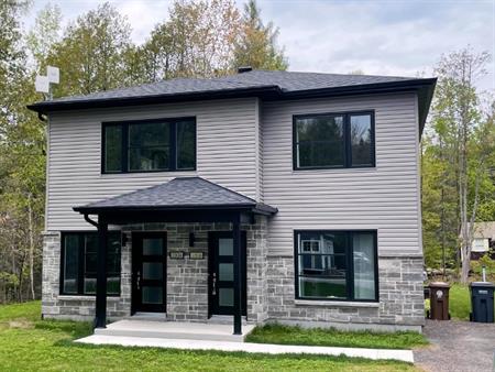 Beau grand 4 1/2 moderne. Immeuble pratiquement neuf (construction 2021)