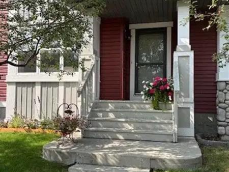 Evergreen Living! Duplex with Storage, Garage & Backyard Oasis | Calgary